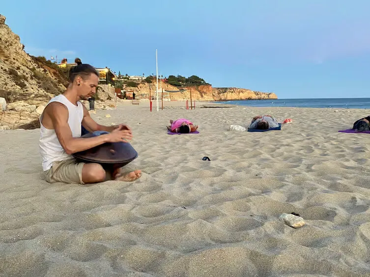 Group of people enjoying Yoga at Praia da Batata, Lagos