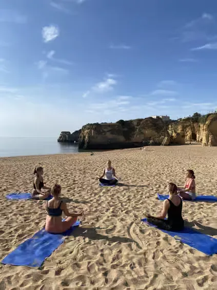 A peaceful morning breathwork and meditation session on the soft sand at a Vilamoura beach.